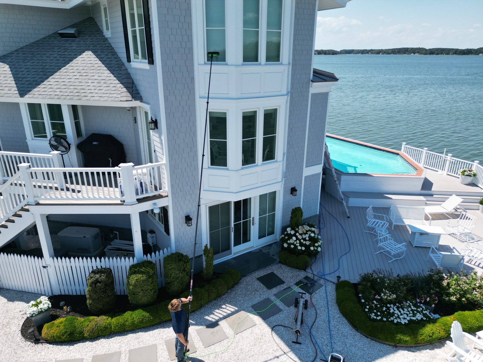 Coastal Shine cleaning the windows of a waterfront home on Maryland's Eastern Shore