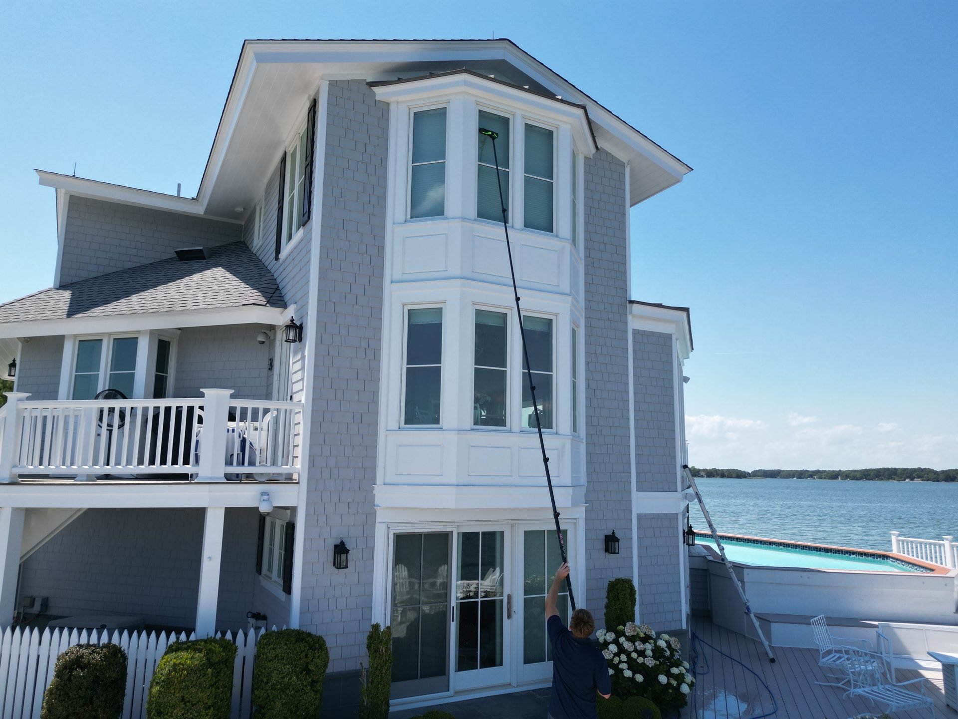 Coastal Shine cleaning the windows of a waterfront home on Maryland's Eastern Shore